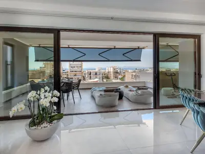 a living room with a view of a city at Athens Riviera Penthouse in Athens