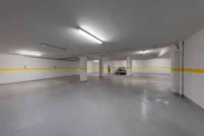 an empty parking garage with a car parked in it at Athens Riviera Penthouse in Athens