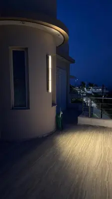 a night view of a balcony of a house at Amazing villa with a magic view to the Aegean in Dhaskalión