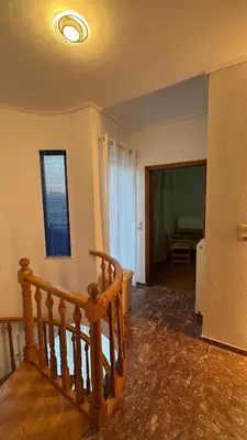 a room with a staircase and a stair case at Amazing villa with a magic view to the Aegean in Dhaskalión