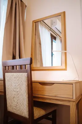 a mirror sitting on top of a wooden desk with a chair at Luxury Apartment in Plaka - Acropolis (Luisa) in Athens