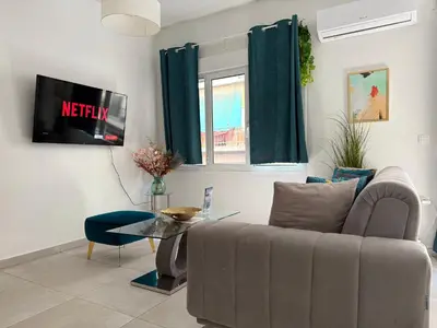 a living room with a couch and a table at P&P Boutique Apartments in Athens