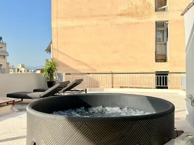 a fire pit on top of a roof at P&P Boutique Apartments in Athens