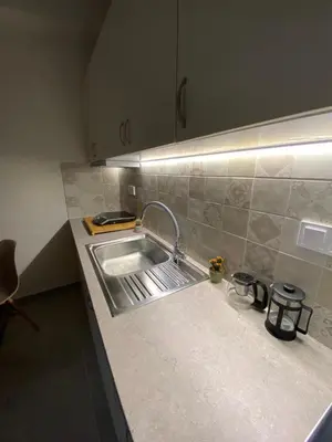 a kitchen with a sink and a counter top at Nike’s Katechaki in Athens