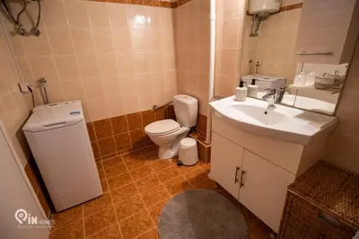 a bathroom with a toilet and a sink at Athenian Sky View - next to Metro in Athens