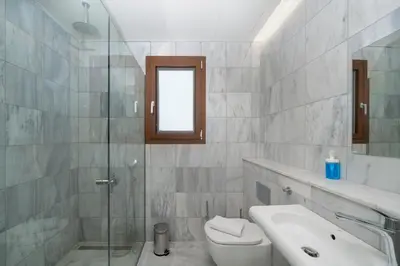 a bathroom with a toilet and a sink and a shower at Mooeve Exarchia in Athens