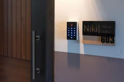 a remote control on a wall next to a door at Niki Athens Suites - Cosy Suite in Monastiraki Historical Centre in Athens