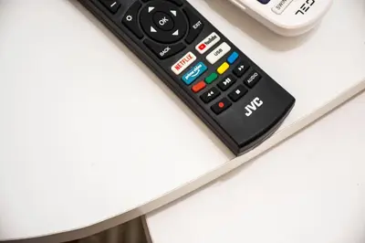 a remote control sitting on top of a table at Newly renovated-City Center Apartment in Athens