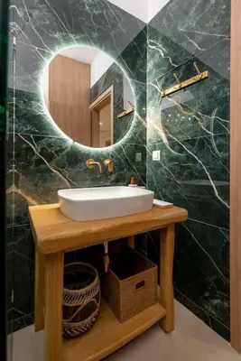 a bathroom with a sink and a mirror at Alios, Luxury Living Athens in Athens