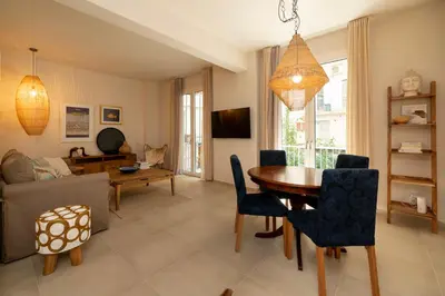 a living room with a table and a couch at Alios, Luxury Living Athens in Athens