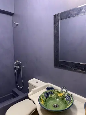 a bathroom with a sink and a toilet at Endless Seaview in Porto Rafti