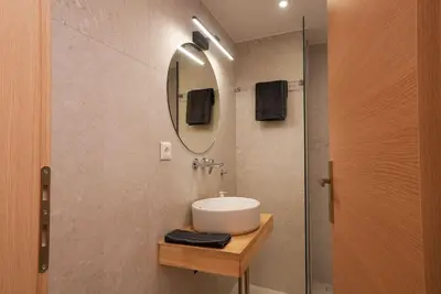 a bathroom with a sink and a mirror at The Downtown Oasis [4' To Panormou Metro Station] in Athens