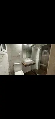 a bathroom with a white toilet and a sink at HP Studio Luxury Apartment in Athens