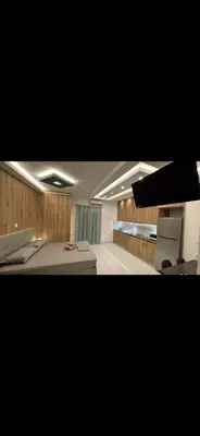 a large room with two beds and a desk at HP Studio Luxury Apartment in Athens