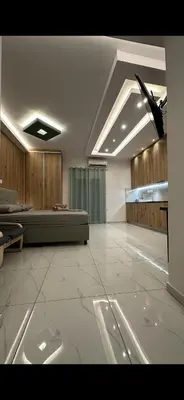 a living room with a couch in a room at HP Studio Luxury Apartment in Athens