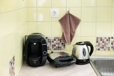 a kitchen counter with a toaster and a tea kettle at Your Perfect Place 1min from Kato Patissia Station -100Mbps in Athens
