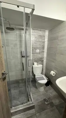 a bathroom with a shower and a toilet and a sink at Kris boy in Athens