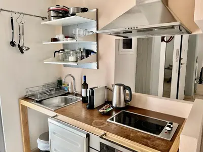 a small kitchen with a sink and a counter at Monastiraki Loft AthensApart in Athens