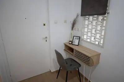 a small room with a desk and a chair at Penthouse in the Heart of Athens in Athens