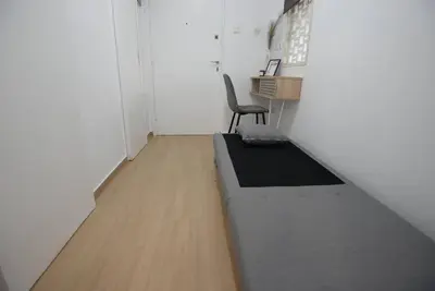 an office with a desk and a chair in a room at Penthouse in the Heart of Athens in Athens