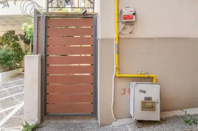 an open door to a building with a pay meter at Pop Art Home - Experience Local Vibes in Athens