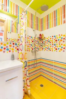 a colorful bathroom with a shower and a shower curtain at Pop Art Home - Experience Local Vibes in Athens