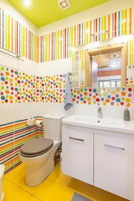 a bathroom with a toilet and a sink at Pop Art Home - Experience Local Vibes in Athens