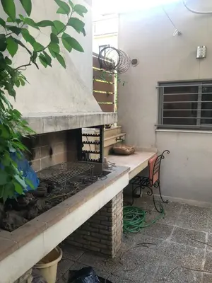 an outdoor grill in a patio with a table at Pop Art Home - Experience Local Vibes in Athens