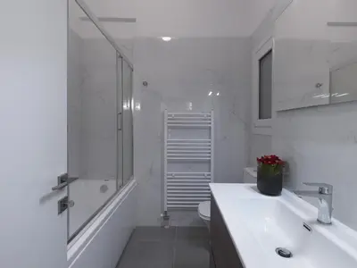 a white bathroom with a sink and a shower at Aiginitou6 in Athens