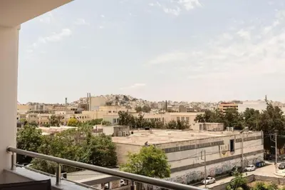 a view of the city from the balcony of a building at Cozy 2-bedroom Apartment in Piraeus (ERM_E9) in Piraeus