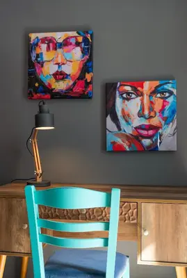 a desk with a chair and a painting on the wall at Neoclassical Loft in Monastiraki - Acropolis and metro in Athens