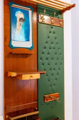 a room with a painting on the wall and a shelf at Neoclassical Loft in Monastiraki - Acropolis and metro in Athens