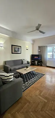 a living room with a couch and a tv at Marina's Luxurious Apartment in Athens, Centre in Athens
