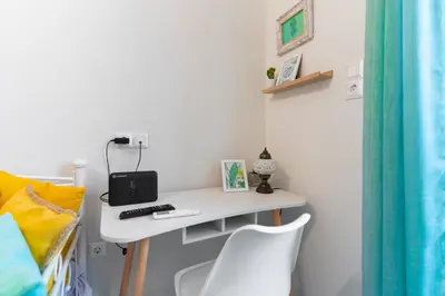 a desk in a room with a bed and a chair at Aiolos kolonaki near Hilton super lux apartment in Athens