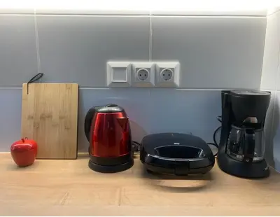 a kitchen counter with a coffee maker and a toaster at Aiolos kolonaki near Hilton super lux apartment in Athens