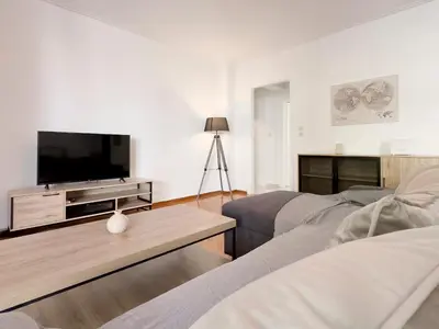 a living room with a tv and a couch at Metamorfoseos Spacious 120sqm apt in Alimos in Athens