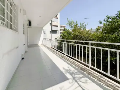 an empty balcony of a building with a railing at Metamorfoseos Spacious 120sqm apt in Alimos in Athens