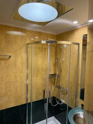 a bathroom with a shower and a sink at Kreoli Hotel in Athens