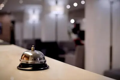 a bell sitting on top of a table at Acropol Hotel in Athens