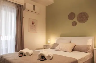 a bedroom with two dogs laying on a bed at Πολυτελές διαμέρισμα-Πασαλιμάνι in Piraeus
