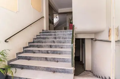 a staircase in a house with concrete steps at Under the Hill in Athens