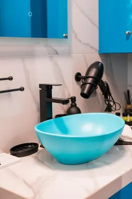 a sink with a blue bowl on a counter at Lux Modern Apt Ανακαινισμένο διαμέρισμα 150m από την πλαζ 'ΈΔΕΜ' in Athens