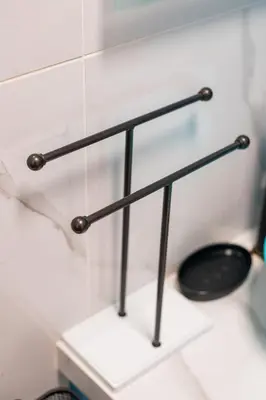 a metal towel rack on a counter in a bathroom at Lux Modern Apt Ανακαινισμένο διαμέρισμα 150m από την πλαζ 'ΈΔΕΜ' in Athens