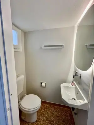 a bathroom with a white toilet and a sink at Athens Classic Luxury 2-Bedroom Apartment in Athens