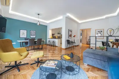 a living room with a couch and chairs at Spacious & bright 2br apt in hip Pangrati, Athens in Athens