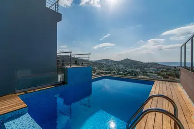 a swimming pool on top of a building at Villa Azzura with sea view & private pool at Athens Riviera in Aghia Marina