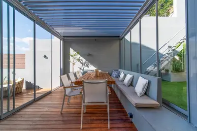a living room with a couch and a table at Villa Azzura with sea view & private pool at Athens Riviera in Aghia Marina
