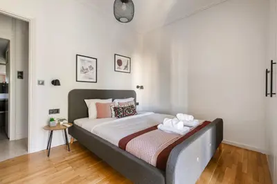 a bedroom with a large bed in a room at Zeus 2-Bedroom Apartment in Athens in Athens