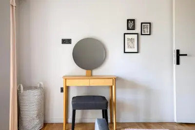 a dressing table with a mirror and a chair at Zeus 2-Bedroom Apartment in Athens in Athens