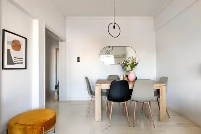 a dining room with a table and chairs at Zeus 2-Bedroom Apartment in Athens in Athens
